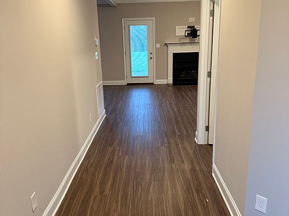 Entry hallway leading to living room.