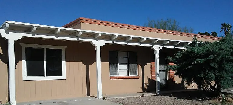 Los Arcos street view. Main house to the right and office to the left.