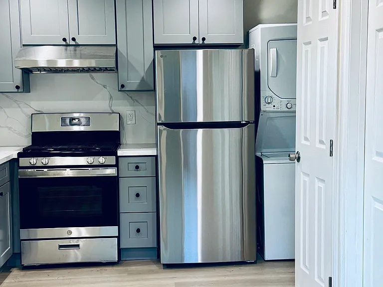 Brand new appliances and in unit stacked washer/dryer.