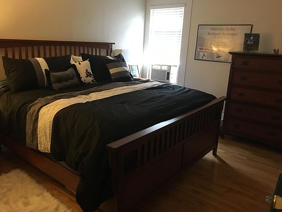 Master bedroom with hardwood floors.