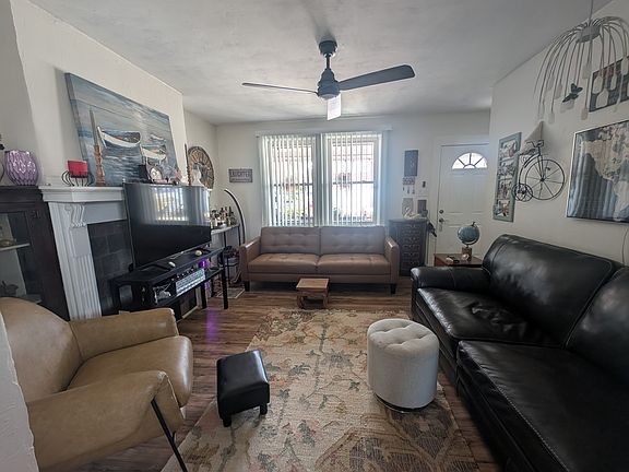This is the living room view from the dining room facing the front entry.
