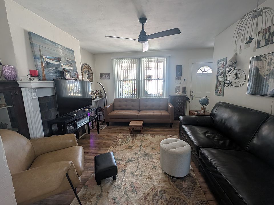This is the living room view from the dining room facing the front entry.