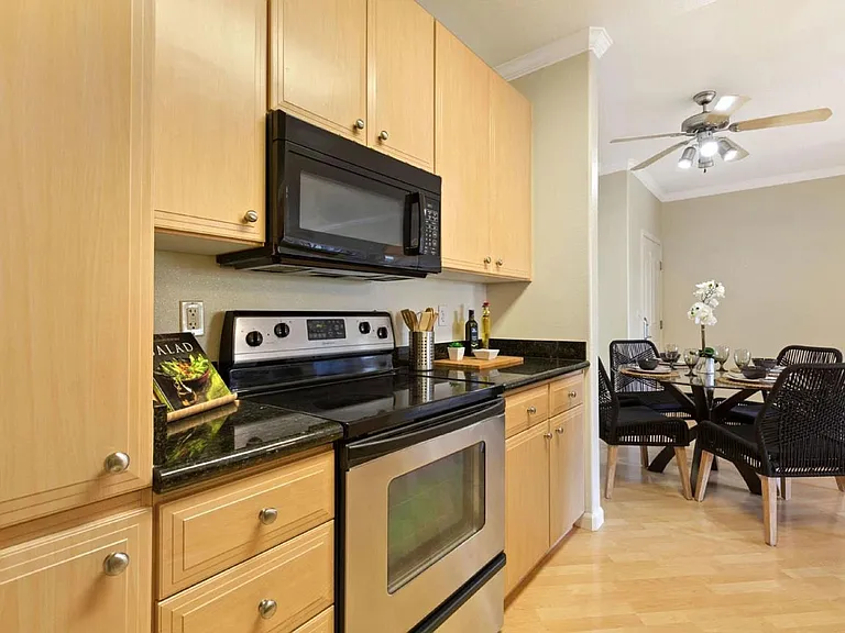Kitchen with microwave, dishwasher and new garbage disposal