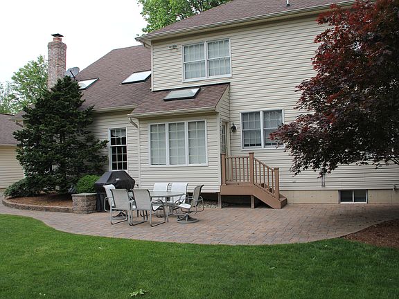 Back of home with patio
