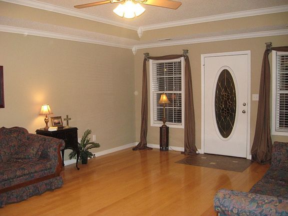 Another view of great room - lots of crown molding and trey celing