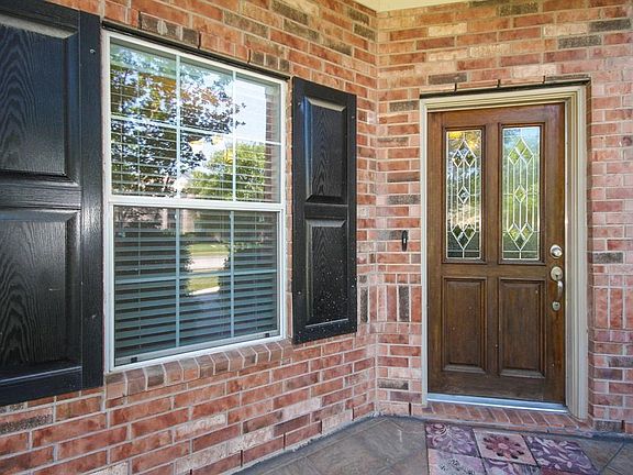 Front door with lead glass. Covered porch.