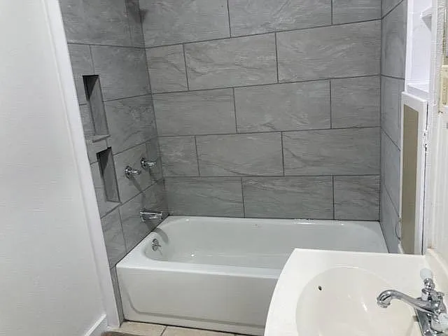 Master tub/shower again. I am standing by the toilet and window.