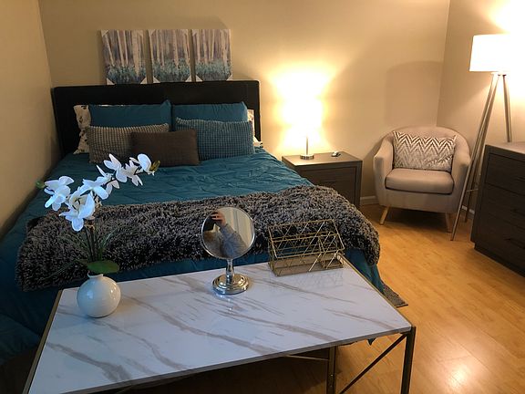 The collapsible desk doubles as a vanity station. Keep it out or tuck it away in the big bedroom closet.