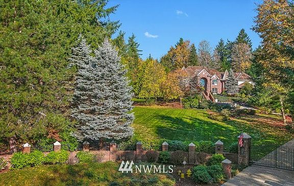 Located in a quiet cul de sac, behind a gated circular drive...