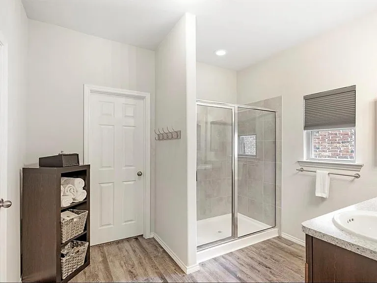 THE MASTER BATH, WITH A LARGE SHOWER AND DUAL VANITIES!