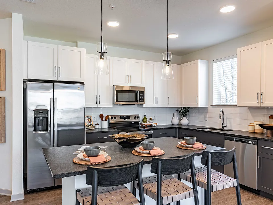 Sleek modern kitchen with stainless steel appliances.