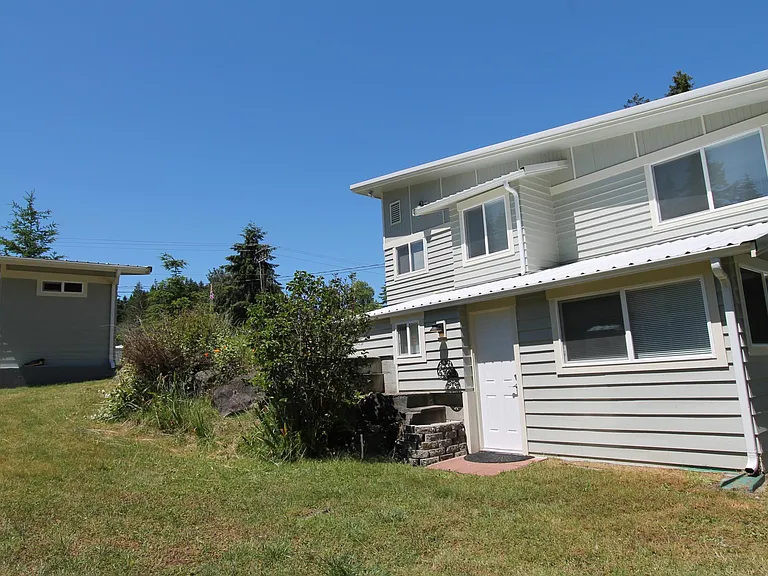 Side of house. Outdoor access to bedroom #3.