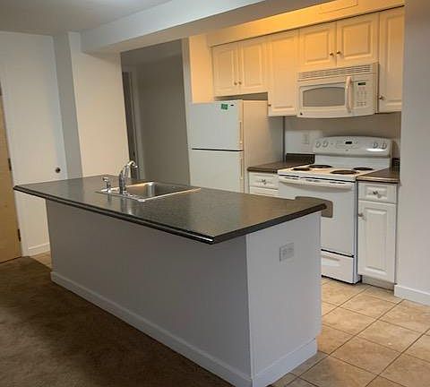 Modern Island Kitchen with Dishwasher, Range, Fridge & Microwave