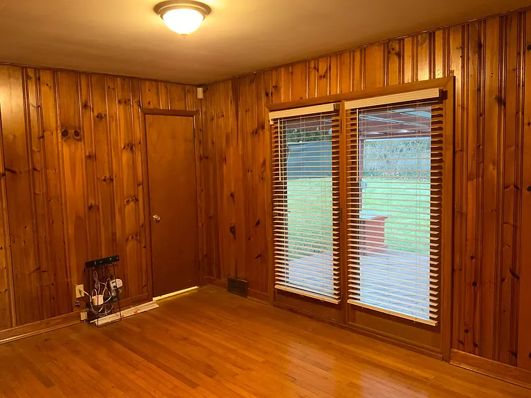 Back side of the house a family room with a view to the deck
