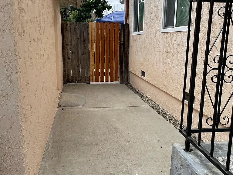 Front Porch to Back Gate between house and garage
