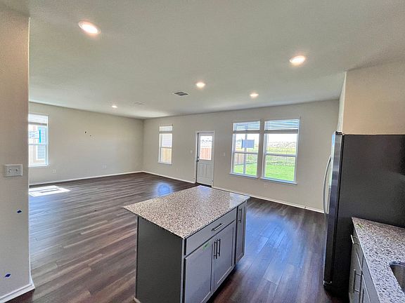 Relax in your living room or dining room with stunning backyard views and total privacy