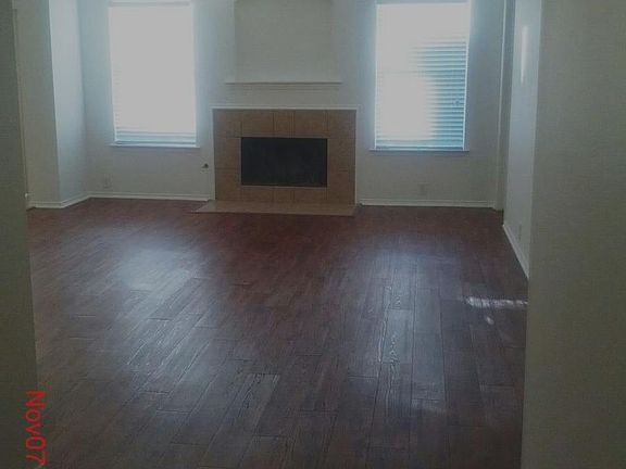 Entry to living area with wood burning fireplace