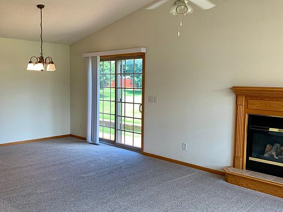 Dining Room with sliding glass door to small platform deck.