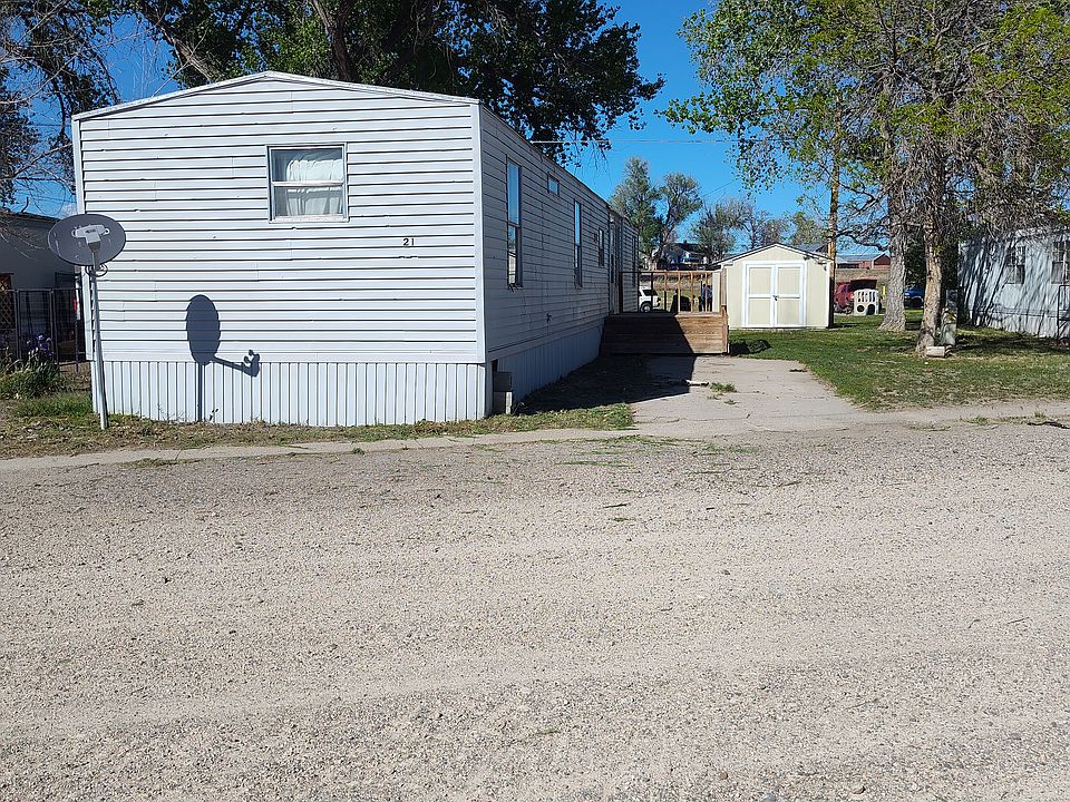 This photo showcases Unit 29, which shares the same exterior appearance as Unit 31 on this property. Both units offer identical outdoor features, making it easy to visualize the space for either option.