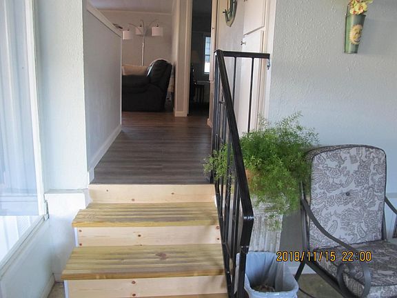 stairs into main home from glassed in lanai
