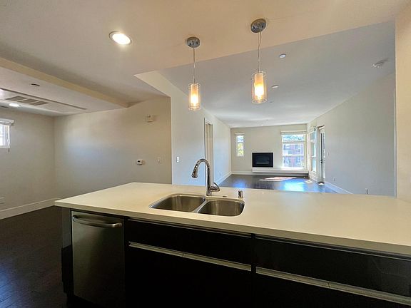 Kitchen with Breakfast Bar with views of Den, Living and Dining