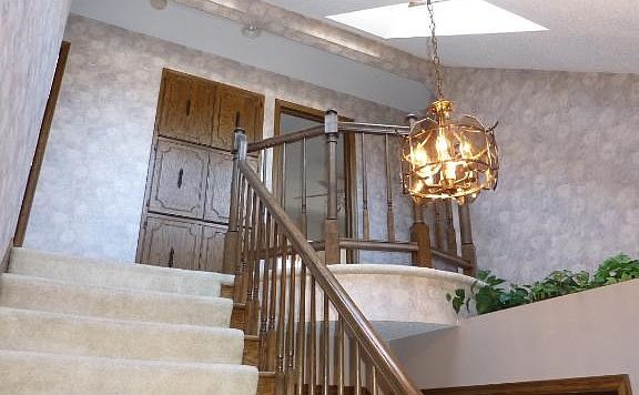 Enter home to an Incredible open stair with princess balcony Note one of two shylights that light the stairs and entry