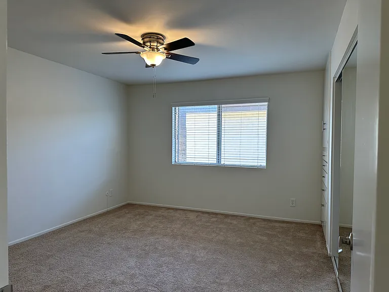 Bedroom with Carpeting and Ceiling Fan