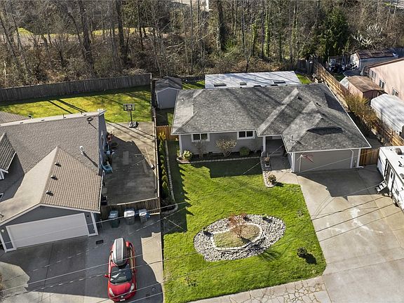 Front exterior aerial view. RV parking with an electrical outlet!>