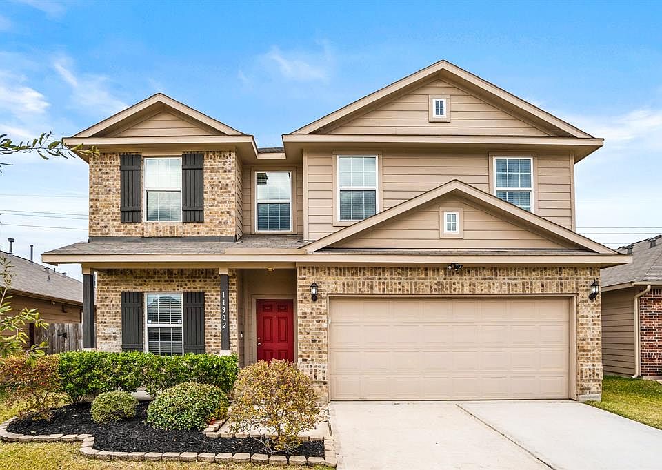 WELCOME to your own magazine cover home! Eye catching curb appeal from the manicured landscaping to the neutral paint compliments the different tones in the bricks! But nothing compares to the welcoming & bright red door! What a statement! This home 