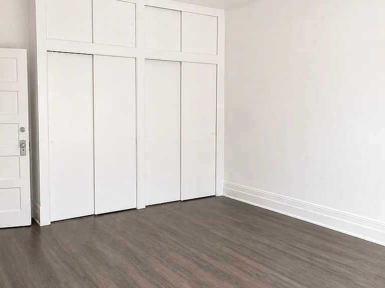 This is a primary bedroom. It's definitely the biggest bedroom. It has enough room to put a king-size bed with a nightstand and a dresser comfortably this bedroom also has three windows that face the back of the house and overlooks the driveway.