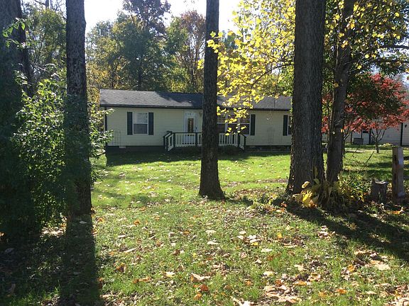 Spacious wooded front and back yard