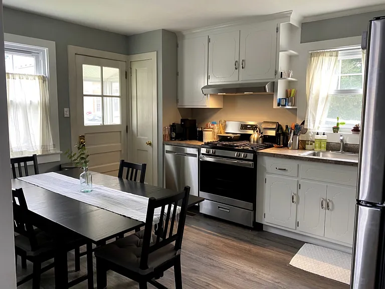 Eat-In kitchen has natural gas stove, dishwasher, and closet pantry.