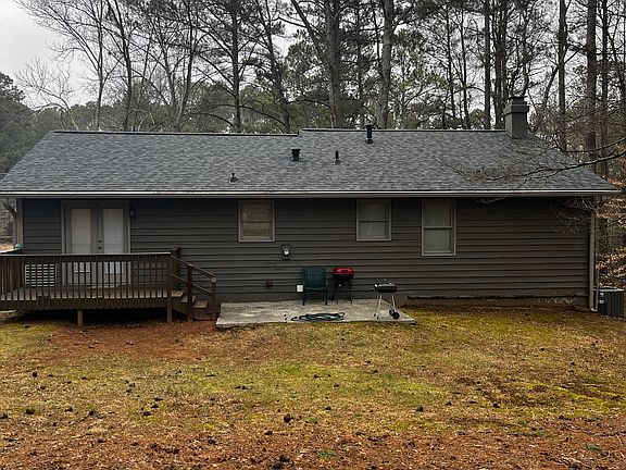Deck, patio and large level fenced backyard