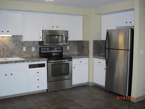New stainless kitchen appliances (dishwasher, stove, microwa