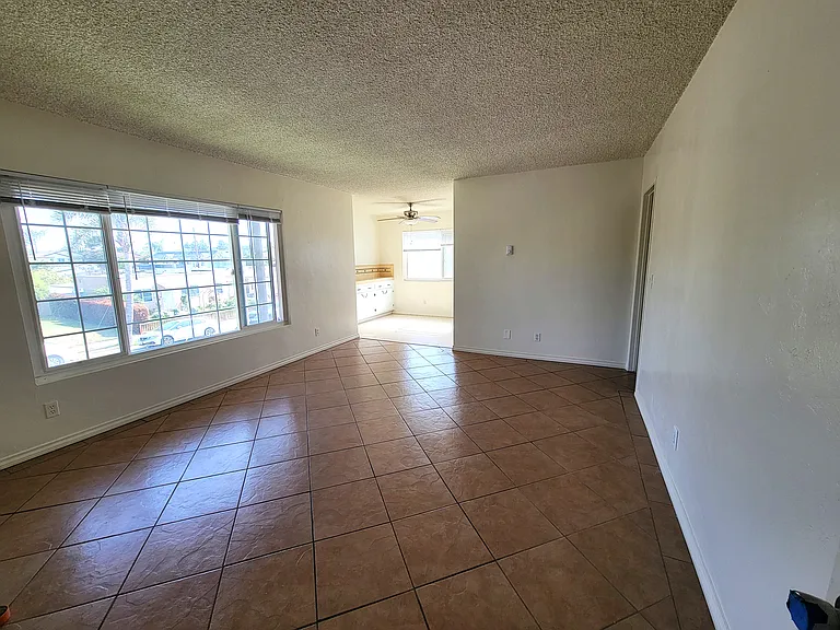 Living Room Unit 4 to Dining Room Window to Street; Radient heat is invisible in ceiling.