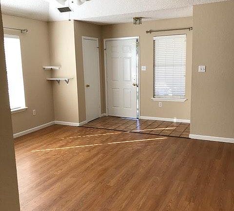 Living Room, tiled entryway. Garage entry at right of tiled floor.