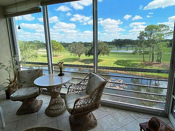 View from lanai shows canal along side of golf course.