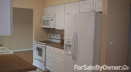 Living room
						:
						Showing wood floor and front entry.
