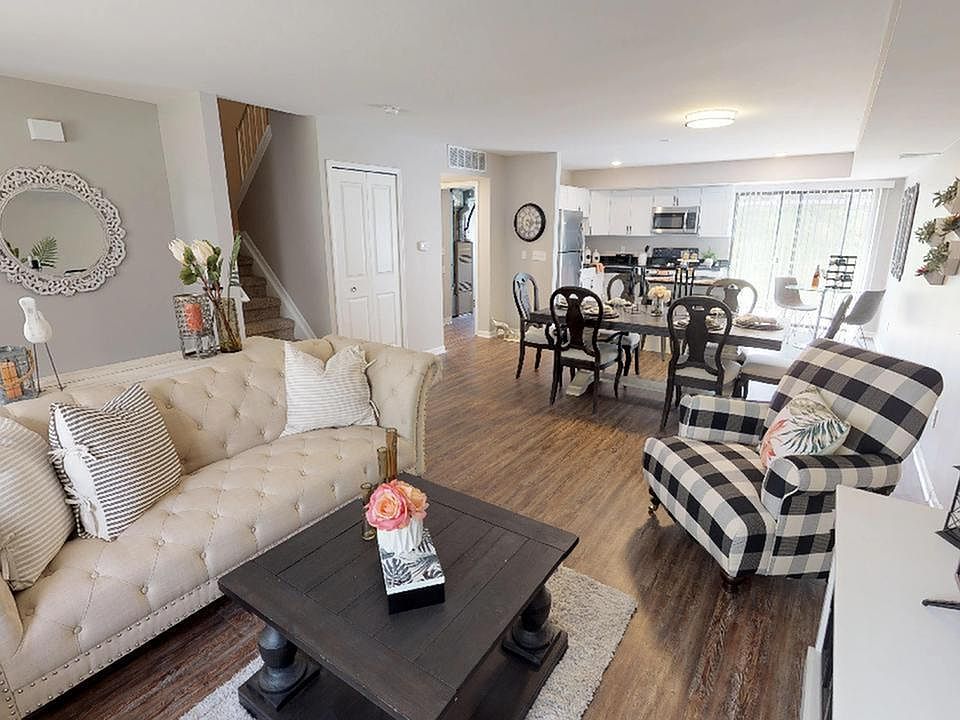 Spacious living room flowing into dining room and kitchen