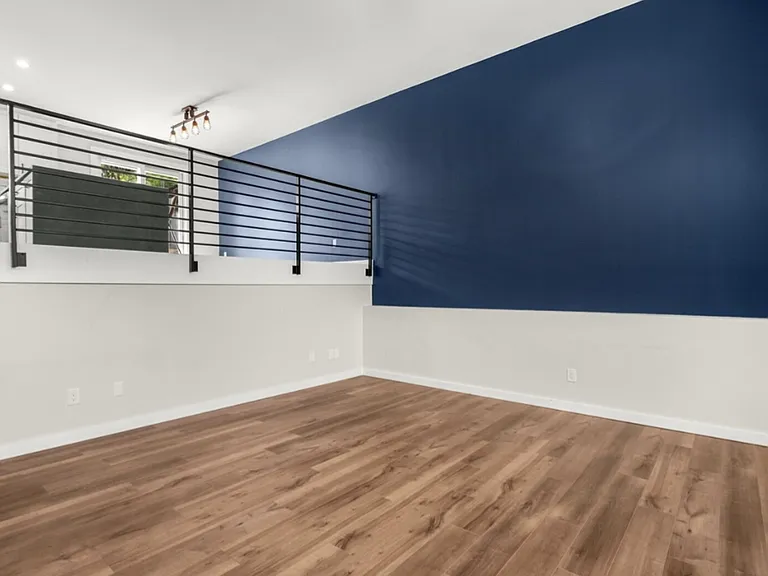 Updated black steel railings. Kitchen overlook living room