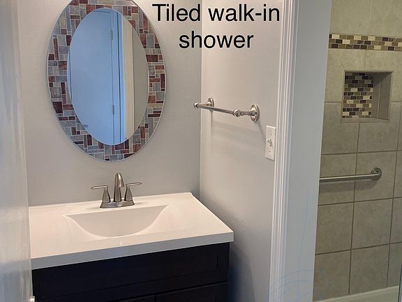 Tiled bath w walk-in shower.