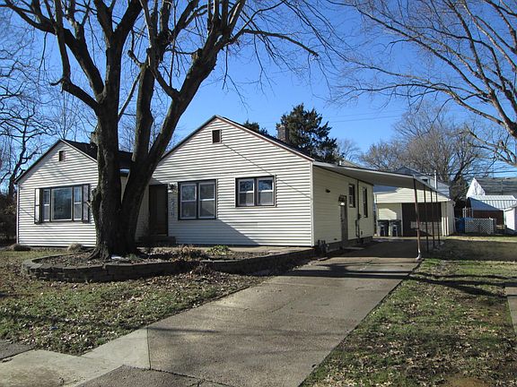 Front of home showing car port.