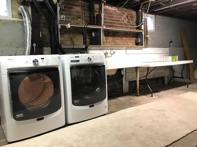 Washer and dryer in spacious basement.