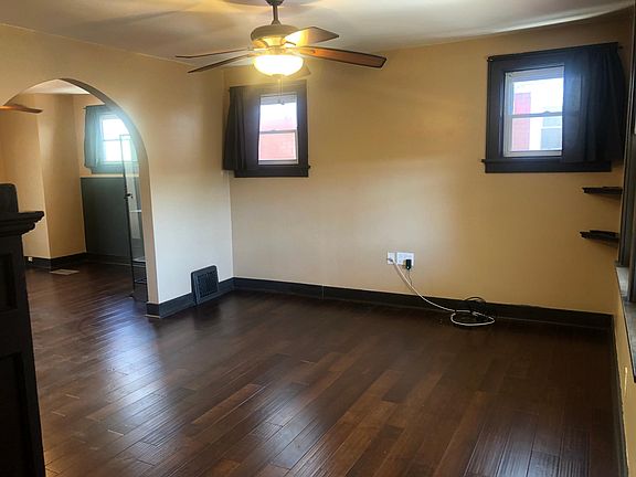 Walking in front door, entrance to living room area.