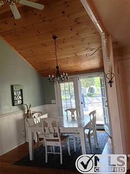 Dining room with French doors to back deck, patio and yard.