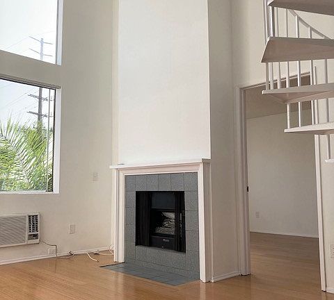 Living room has double-height ceiling