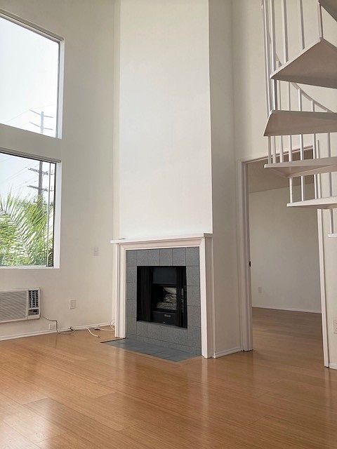 Living room has double-height ceiling