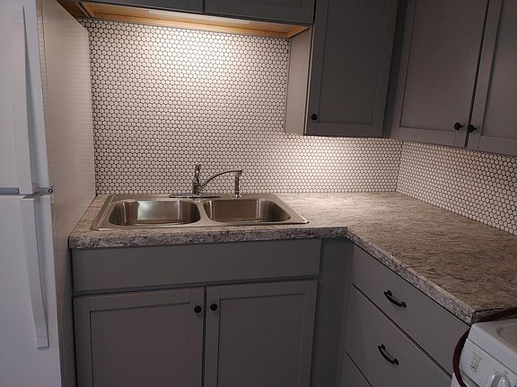 Note the new ceramic back spash and counter tops.