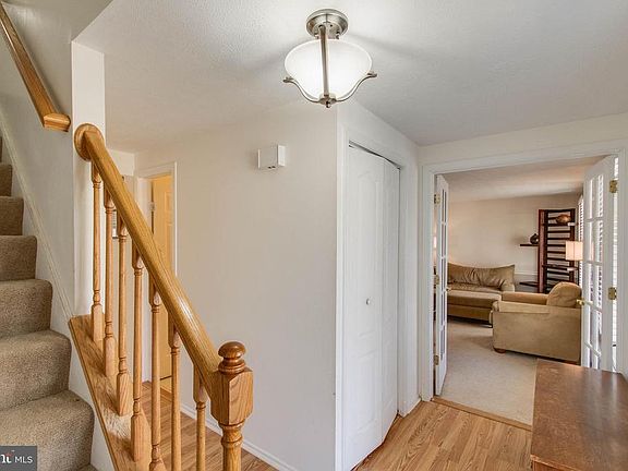 Entry w/ coat closet and french doors to LR
