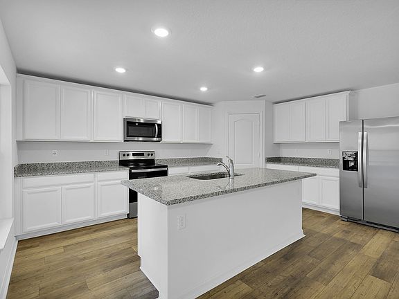 This move-in ready home features gorgeous granite countertops in the kitchen
